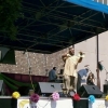 GRANDE GATO at 2008 HISPANIC FESTIVAL onstage holding up third book published WS,NC(2nd pic)
